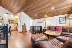 a living room with a couch and a table at Grizzly Den in Whitefish