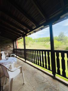 a porch with a table and chairs and a view at Hause Sogambros 2 in Taxiarchis +10 photos