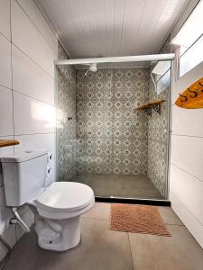 a bathroom with a toilet and a shower at Ilha Grande Inn in Abraão +135 photos