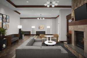 a living room with a couch and a fireplace at Homewood Suites by Hilton Oklahoma City-Bricktown in Oklahoma City