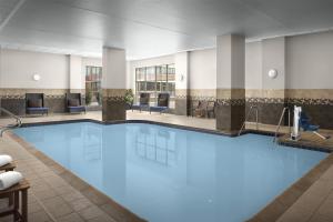 a large pool with blue water in a hotel room at Homewood Suites by Hilton Oklahoma City-Bricktown in Oklahoma City
