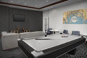 a pool table in a room with couches and a tv at Homewood Suites by Hilton Oklahoma City-Bricktown in Oklahoma City +38 photos