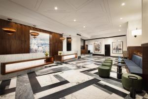 a lobby of a hotel with a reception desk and chairs at Hilton Boston Back Bay in Boston