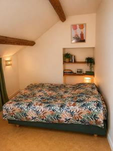 a bedroom with a bed in a room at La Longère de la Promenade in Château-Chinon