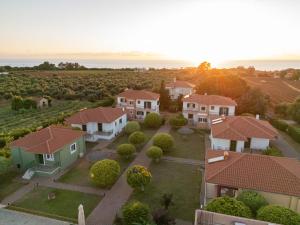an aerial view of a house with a yard at Stomio Villague in Filiatra +36 photos