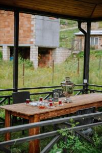 a wooden table with a trophy on a porch at Quba Garden Resort in Quba