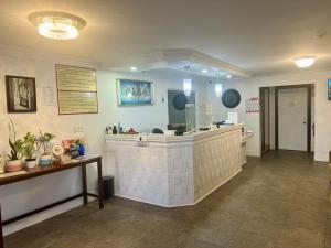 a waiting room with a counter in a hospital at Seely's Motel in Shediac +80 photos