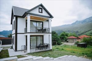 a house with a view of the mountains at Quba Garden Resort in Quba
