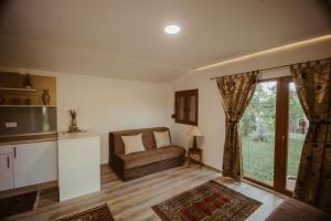 a living room with a couch and a window at Holiday home Emma in Ripač