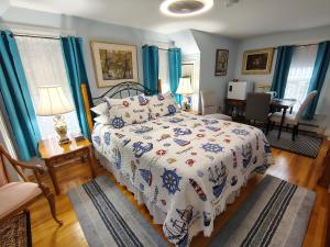 a bedroom with a bed and a dining room at Digby Bed and Breakfast in Digby