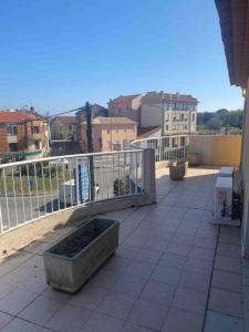 a balcony of a building with a railing at Spacious 3-room apartment in Fréjus
