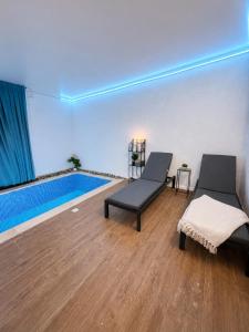 a room with two beds and a swimming pool at קסם צפתי in Safed