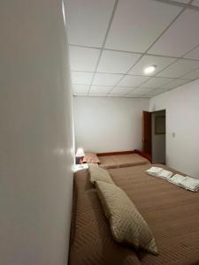 a room with two beds in a room at Jade in Chajarí +3 photos
