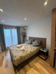 a bedroom with a large bed and a table at Studio in Cogolin