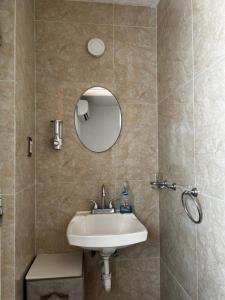 a bathroom with a sink and a mirror at Casa Múkara del Puerto in Veracruz +13 photos