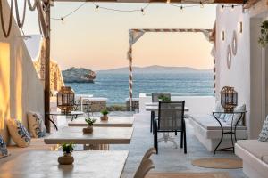 a living room with a view of the ocean at Silia Dream View in Houlakia +51 photos