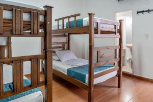 a bedroom with two bunk beds in a room at Casa Blanca in Santa Marta +8 photos