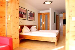 Postel nebo postele na pokoji v ubytování Hotel Binggl