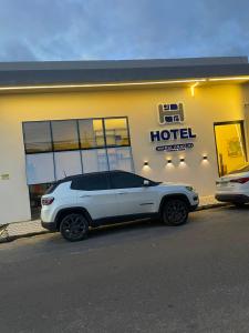 a white car parked in front of a hotel at Hotel maria araujo in Arapiraca +14 photos