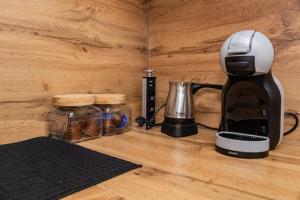 a coffee maker sitting on top of a counter at IlieskiApartment in Prilep