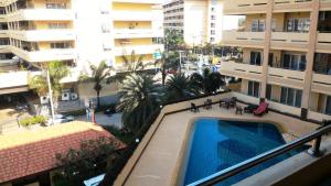 a view of a swimming pool from a balcony of a building at View Talay Residence 4 in Jomtien Beach
