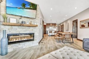 a living room with a fireplace and a dining room at Bridges Bay Resort Bayside Building 203 in Arnolds Park
