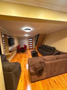 a living room with a couch and a table at NurHome in Mejillones