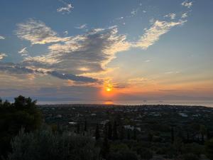 a sunset from the top of a hill at Golden Hour on the Hill in Aegina