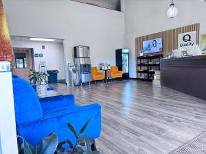 a waiting room with a blue couch in a store at Quality Inn Spearfish I-90 in Spearfish