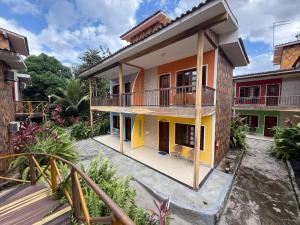 a view of a house with a balcony at Pousada Pedra Grande in Morros