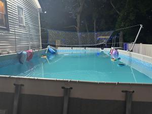 a large swimming pool with a net in it at Private basement apartment with separate entrance in Yonkers