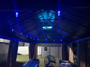 a pergola with blue lights on top of it at Private basement apartment with separate entrance in Yonkers