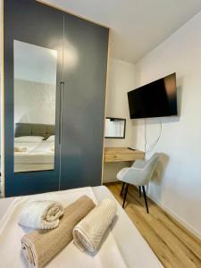 a bedroom with a bed with a sliding glass door at Villa Ivana in Peroj