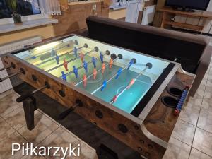 a pool table with people playing a game at Bursztyn in Władysławowo