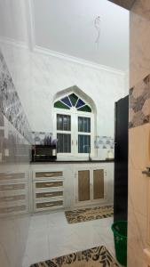 a kitchen with a sink and a window at Shanayah house in Zanzibar City +7 photos