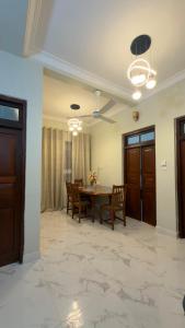 a dining room with a table and chairs at Shanayah house in Zanzibar City