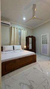 a bedroom with a large bed in a room at Shanayah house in Zanzibar City