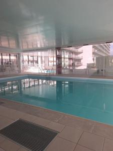 a large swimming pool in a large building at Lagunabeach Knokke-Heist in Knokke-Heist