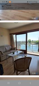 a living room with a couch and a table at Lagunabeach Knokke-Heist in Knokke-Heist