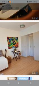 a room with a bed and a table and a painting at Lagunabeach Knokke-Heist in Knokke-Heist