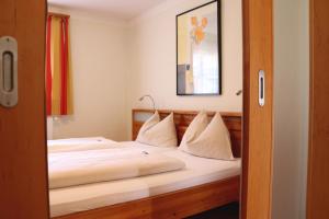 Postel nebo postele na pokoji v ubytování Hotel Binggl