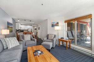 a living room with a couch and chairs and a table at Lake Placid Lodge by Whiski Jack in Whistler