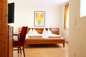 Postel nebo postele na pokoji v ubytování Hotel Binggl