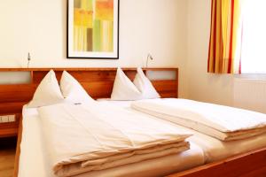 Postel nebo postele na pokoji v ubytování Hotel Binggl