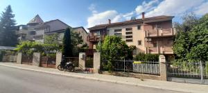 a motorcycle parked on a sidewalk next to a building at 10Forward apt2 in Bitola