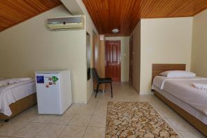 A bed or beds in a room at Gizem Pansiyon