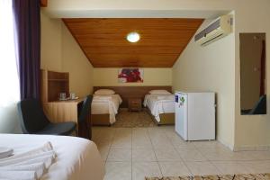 A bed or beds in a room at Gizem Pansiyon