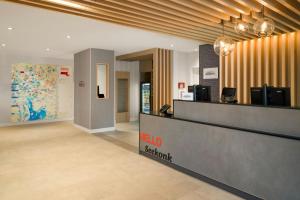 a lobby of a hotel with a reception desk at TownePlace Suites by Marriott Seekonk in Seekonk
