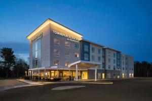a large building with lights on in a parking lot at TownePlace Suites by Marriott Seekonk in Seekonk