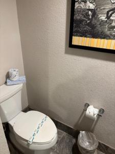 a bathroom with a white toilet in a room at Primm Valley Hotel & Casino in Jean